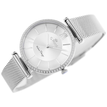 Analogowy zegarek damski marki G.Rossi na srebrnej bransolecie mesh. Srebrne wskazówki i indeksy na srebrnej tarczy z cyfrą rzymską (12). Koperta zegarka ozdobiona cyrkoniami, w rozmiarze 35 mm.