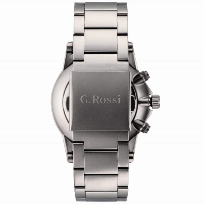 Zegarek męski G.Rossi na srebrnej bransolecie. Czarne wskazówki i indeksy (rzymskie cyfry) na srebrnej tarczy z datownikiem. Średnica koperty zegarka wynosi 42 mm.